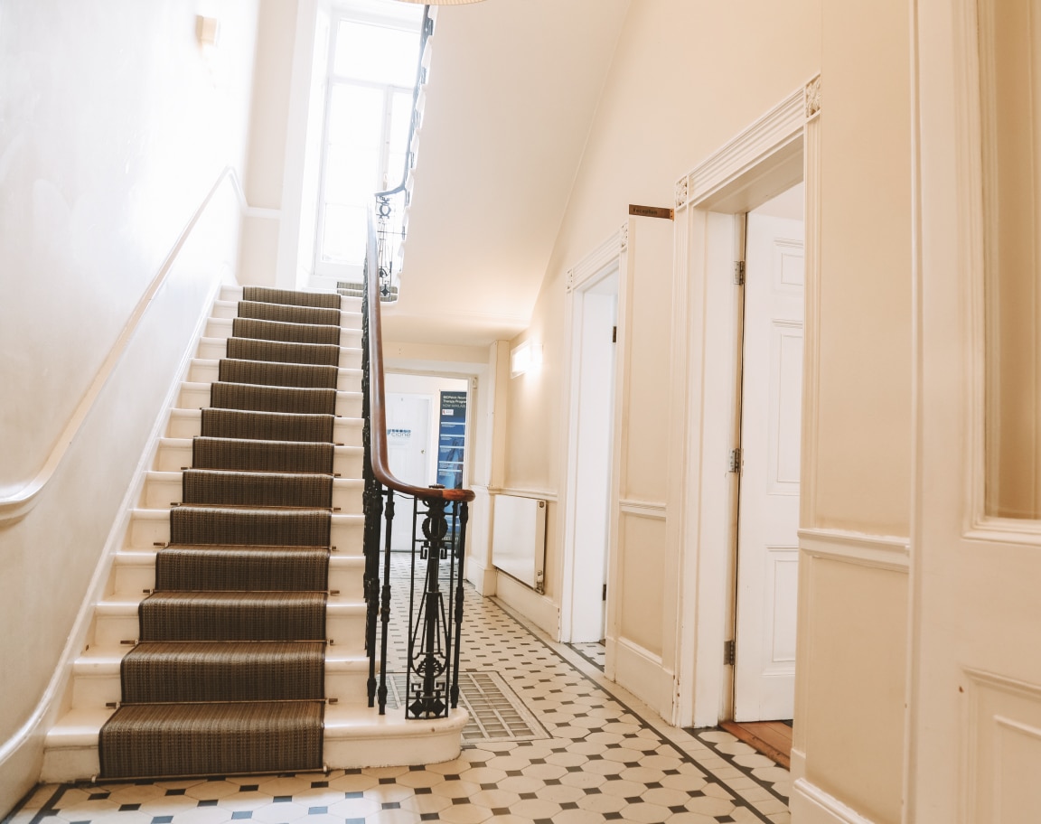 Interior staircase and hallway inside Vinci Hair Clinic