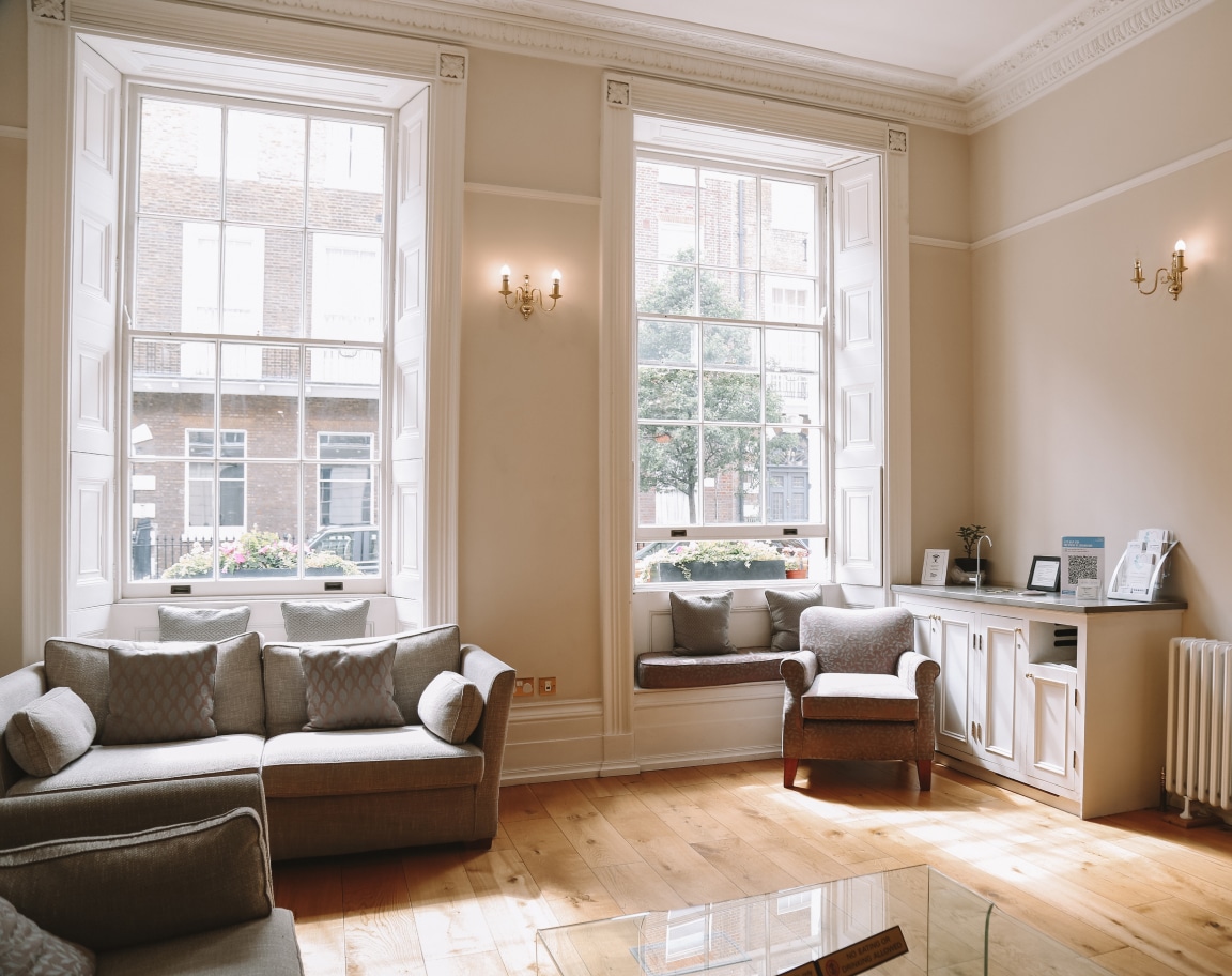 Bright waiting room with large windows inside Vinci Hair Clinic