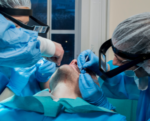 A man recieving a beard transplant at vinci hair clinic